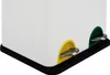 A close-up view of the bottom corner of a white trash can with two pedal-operated openings, one yellow and one green. Voir les images du produit