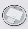 The back of a round black-framed mirror with internal components visible. Produktbild-Vorschau
