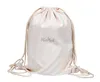 A beige drawstring bag with the brand name 'MioMat' printed on it. Produktbild-Vorschau