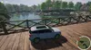 A car is parked on a wooden bridge overlooking a lake with trees in the background. Anteprima dell’immagine prodotto