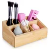 A bamboo organizer filled with makeup accessories. Náhled obrázku produktu