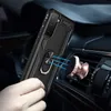 A hand holding a black phone case with a ring holder, about to attach it to a magnetic car mount attached to a car air vent. Produktbild-Vorschau