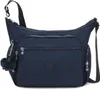 A navy blue Kipling crossbody bag with a furry monkey charm. Produktbild-Vorschau