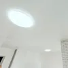 A bright, modern interior with a white ceiling and white brick accents. Produktbild-Vorschau