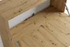 Close-up view of an open wooden cabinet with metal hinges, showing the interior and part of the floor. Produktbild-Vorschau