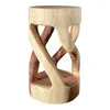 A wooden stool with a carved, twisted base and a flat top, presented against a white background. Anteprima dell’immagine prodotto