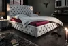 A luxurious bedroom scene featuring a tufted velvet bed. Náhled obrázku produktu
