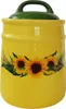 A yellow ceramic jar with a green lid and a sunflower design. Produktbild-Vorschau