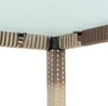 A close-up view of the corner of a polyrattan table, showing the woven texture and metal support structure. Produktbild-Vorschau