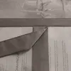 A close-up view of a gray fabric curtain with text printed on it. Produktbild-Vorschau