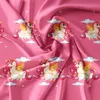 A repeating pattern of unicorns on a pink fabric background. Produktbild-Vorschau