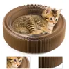 A kitten rests in a round, corrugated cardboard cat scratching bed. Produktbild-Vorschau