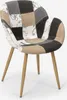 A patchwork chair with wooden legs on a white background. Voir les images du produit