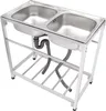 A stainless steel double sink with a metal frame and plumbing underneath, shown against a white background. Podgląd zdjęcia produktu