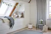 A cozy bedroom with a window seat and an air purifier. Náhľad obrázku produktu