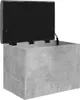 An open storage ottoman with a gray, concrete-like exterior and a black interior. Náhled obrázku produktu