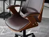 A close-up view of a brown office chair with wooden accents. Produktbild-Vorschau