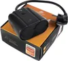 A black smart plug with a power cord and plug rests on its orange and black product packaging. Náhled obrázku produktu