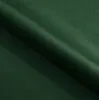 A close-up view of dark green velvet fabric, showing folds and texture. Náhľad obrázku produktu