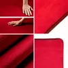 A collage of images showing a red carpet from different angles, including close-ups of its texture and a hand touching it. Podgląd zdjęcia produktu