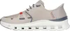 A side view of a single athletic shoe. Voir les images du produit