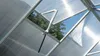 Interior view of a greenhouse roof with an automatic vent opening to the outside. Produktbild-Vorschau