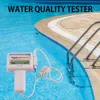 A water quality tester is placed next to the edge of a swimming pool. Náhled obrázku produktu