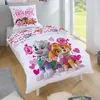 A Paw Patrol themed bed set with a pillow and duvet cover featuring cartoon dogs and hearts, displayed on a bed. Produktbild-Vorschau