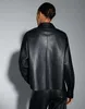 A person is shown from the back wearing a black leather jacket. Produktbild-Vorschau