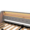 Close-up view of the headboard of a daybed, showing the upholstered fabric, tufting, nailhead trim, and integrated LED lighting. Produktbild-Vorschau