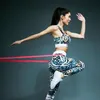 A woman is performing a fitness exercise with resistance bands. Náhľad obrázku produktu