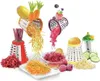 A collection of kitchen graters and shredded fruits and vegetables, presented in a visually appealing arrangement. Produktbild-Vorschau