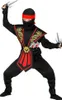 A child wearing a ninja costume, holding toy weapons. Anteprima dell’immagine prodotto