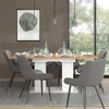 A dining room scene with a table and chairs set for a meal. Voir les images du produit