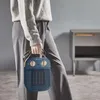 A person holding a portable heater. Voir les images du produit