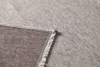 A close-up view of the corner of a blanket, showing the texture and stitching. Produktbild-Vorschau