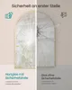 A split image comparing two types of glass, one with safety film and one without, demonstrating the difference when broken. The left side shows glass that remains intact with safety film, while the right side shows glass that shatters into dangerous shards Náhled obrázku produktu