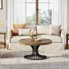 A living room scene with a couch, coffee table, and rug. Voir les images du produit