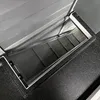 A close-up view of the interior of a wooden rabbit hutch, showing the slatted floor and the underside of the lid. Voir les images du produit