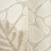 Close-up of a textured rug with an abstract pebble or stone pattern. Náhled obrázku produktu