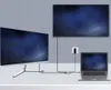 A laptop connected to two monitors via a USB-C adapter, demonstrating extended display capabilities. Anteprima dell’immagine prodotto