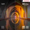 A split image comparing SDR and Dolby Vision display quality, showing an arched hallway with reflections. Podgląd zdjęcia produktu