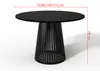 A black round dining table with a unique base, shown on a white background with dimensions indicated. Produktbild-Vorschau