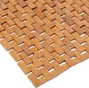 A close-up view of a bamboo bath mat with water droplets on it. Anteprima dell’immagine prodotto