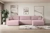 A pink sectional sofa is arranged in a living room setting with artwork on the wall and a plant.