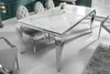 A dining table with chairs in a room. Náhled obrázku produktu