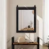 A mirror with a sliding barn door hardware is mounted on a wall above a wooden bench with a handbag on it. Podgląd zdjęcia produktu