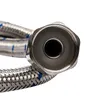 A close-up view of the end of a braided metal hose with a hexagonal fitting. Podgląd zdjęcia produktu