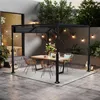 An outdoor patio scene with a pergola, dining table, and chairs. Náhled obrázku produktu