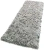 A fluffy gray rug is shown from a slightly elevated angle against a white background. Produktbild-Vorschau